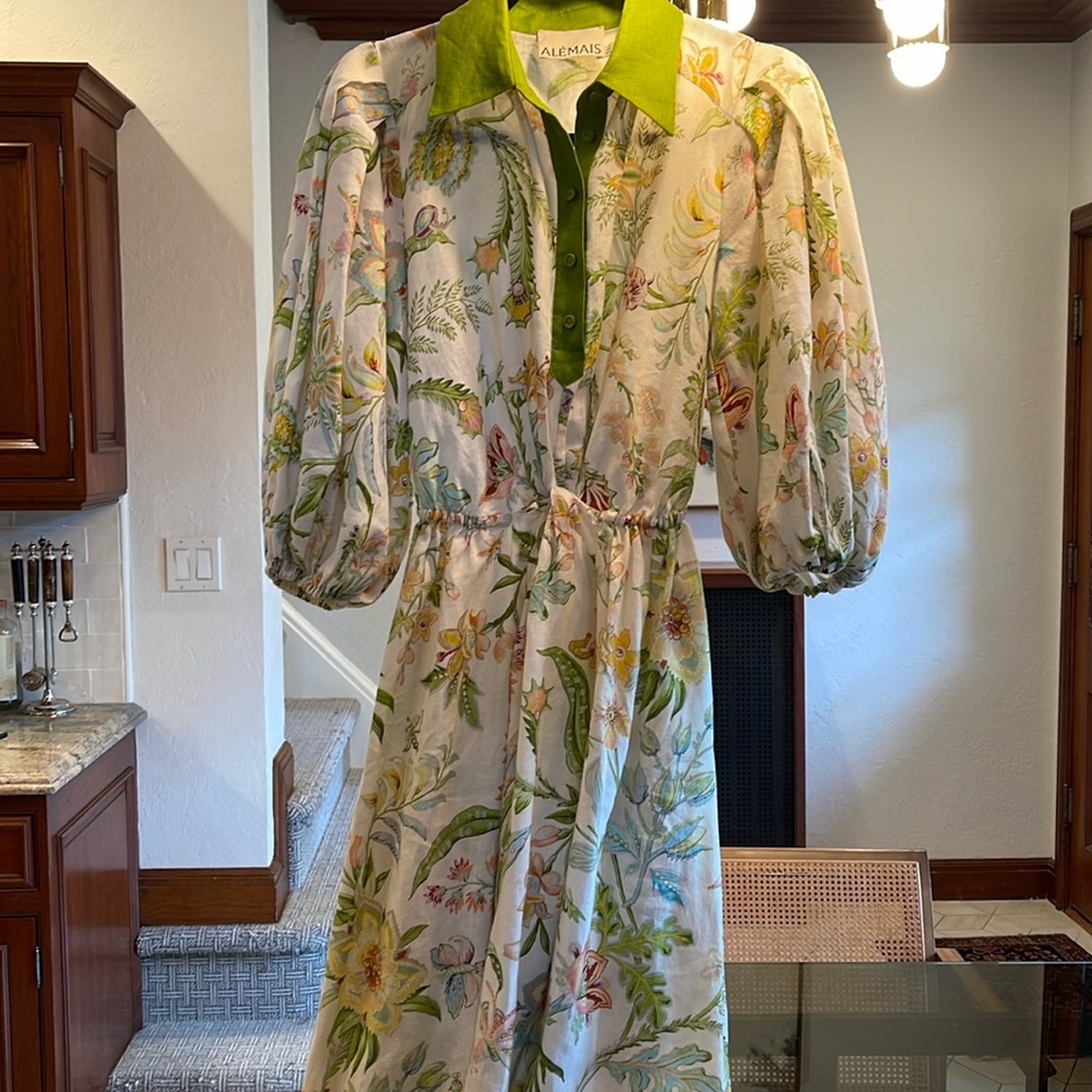 ALÉMAIS
Ira twist-front cutout floral-print linen midi shirt dress.
